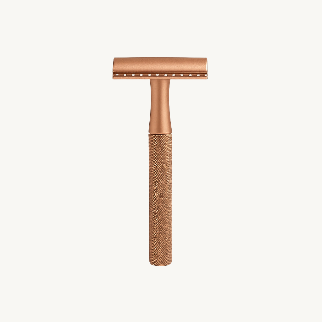 Rose gold safety razor on a white background